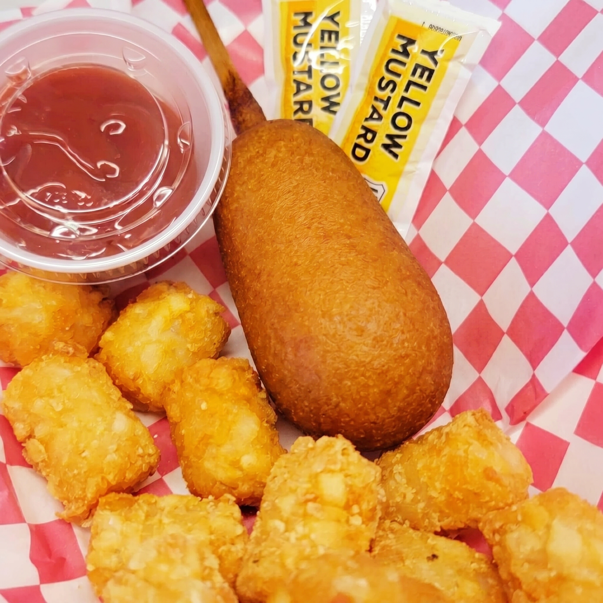 Kids corndog with a half order of crispy tots