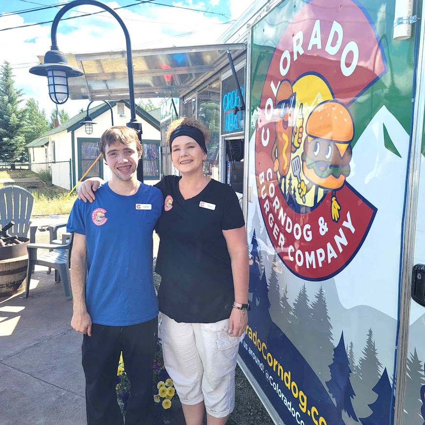 Tonja and Daniel four years later in front of the rebranded Colorado Corndog & Burger Company food truck in Fraser, Colorado