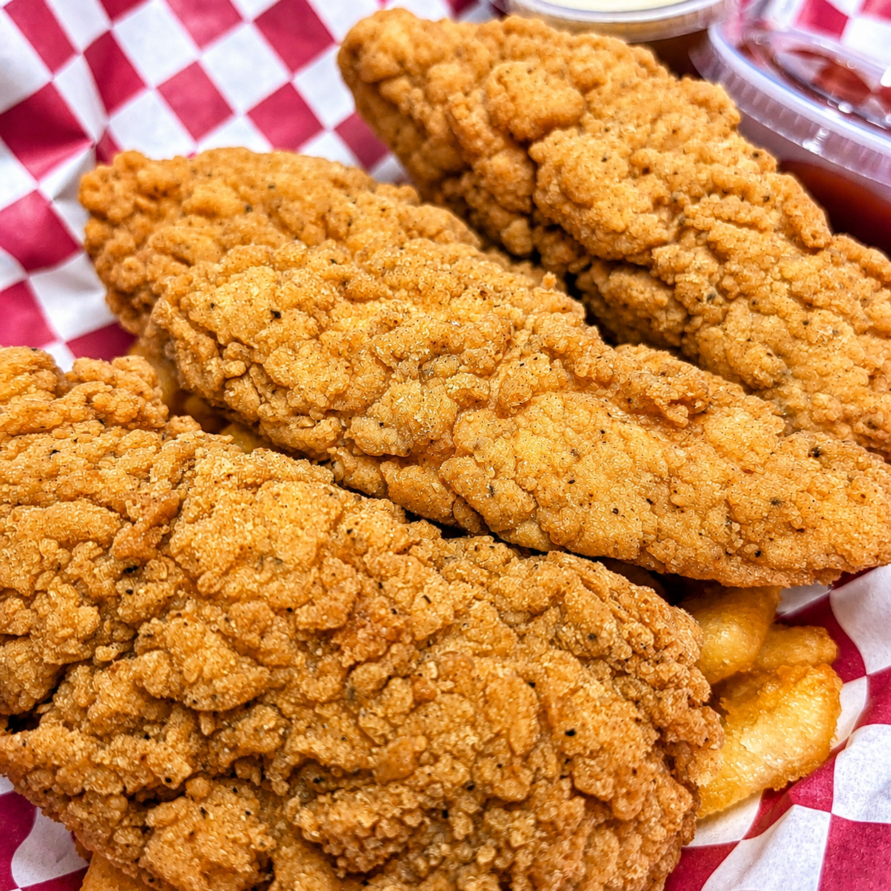 Three-piece crispy chicken tender order from Colorado Corndog & Burger Company