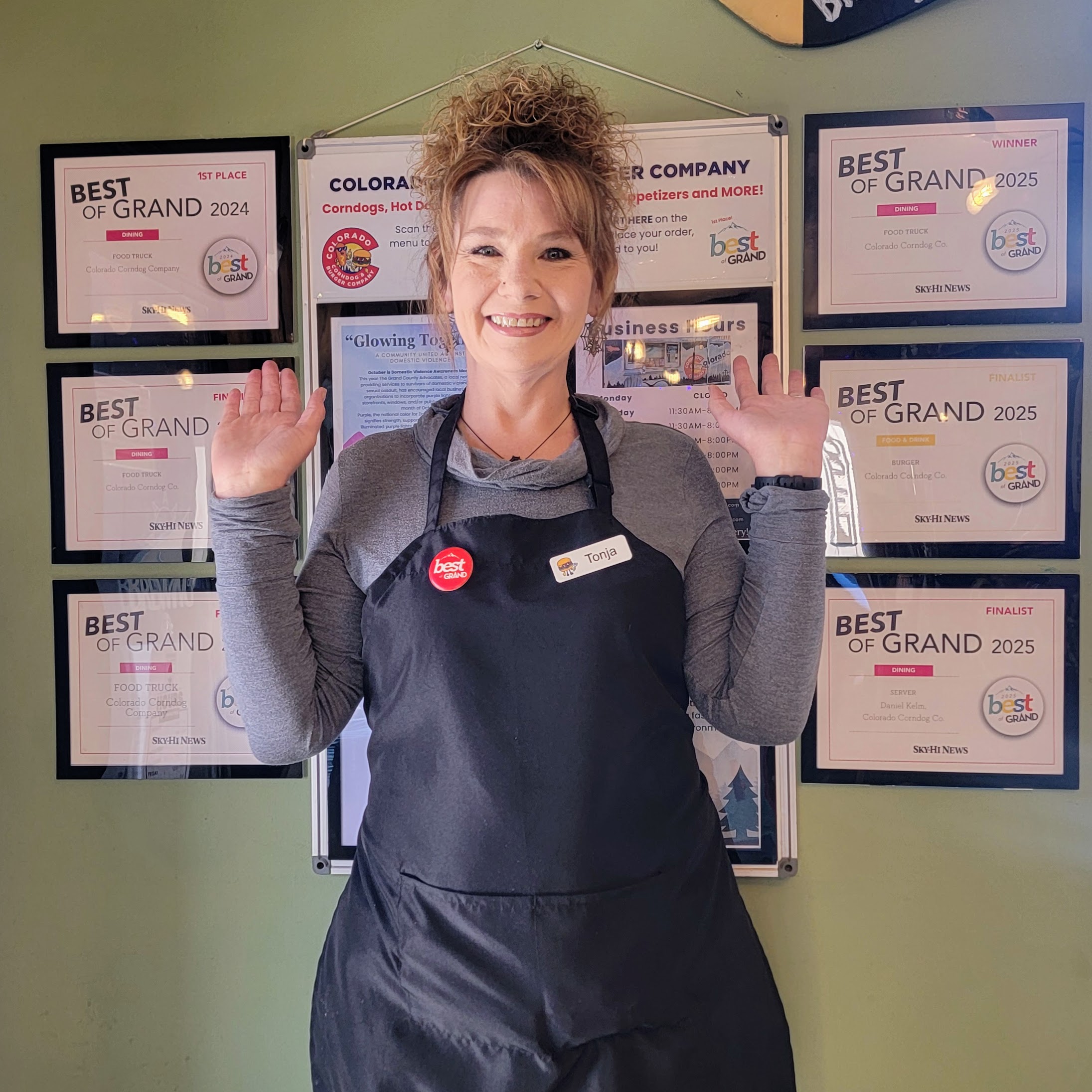 Colorado Corndog & Burger Company owner with Best of Grand awards inside Camber Brewing Company in Fraser, Colorado