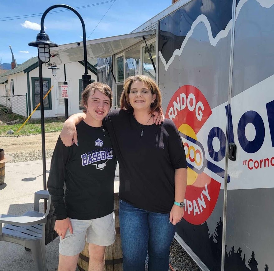 Tonja and Daniel in front of the original Colorado Corndog Company food truck in Fraser, Colorado