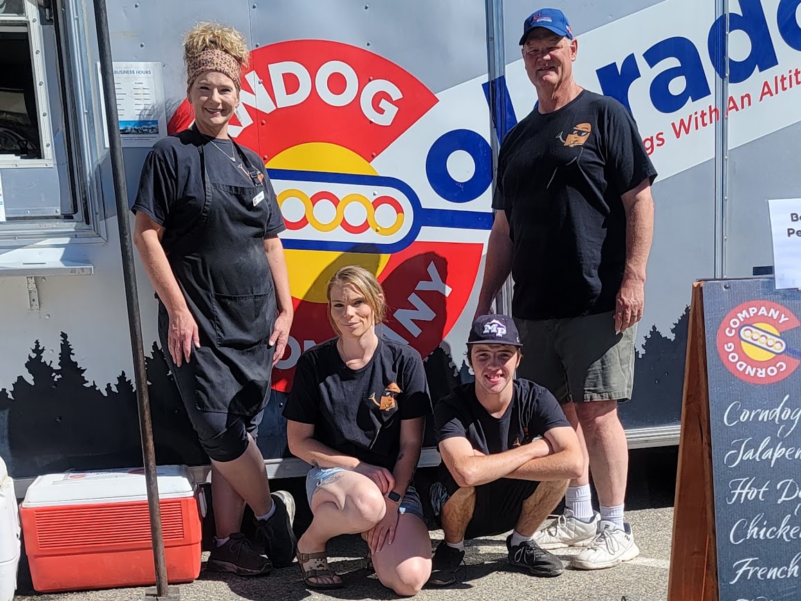 Tonja, Kevin, Daniel and Shaila with the original Colorado Corndog Company food truck at a Grand County event